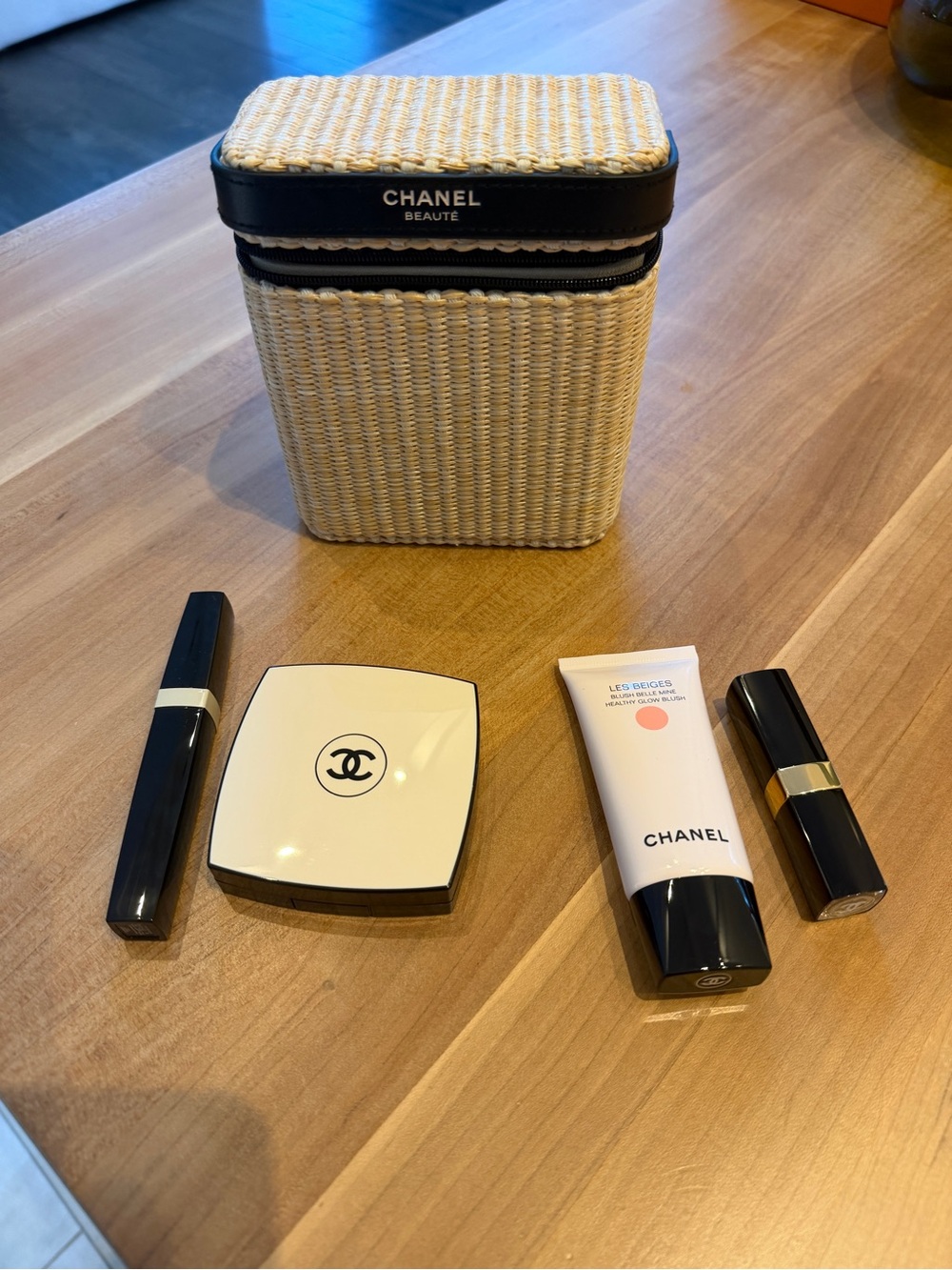 CHANEL Straw Cosmetic Case in Natural and Black with products
